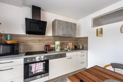 Image de Appartement 'Am SĂĽĂźen See' avec vue sur le lac, balcon et Wi-Fi