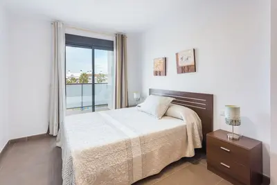 Image de Appartement 'Atico Residencial Las Dunas' avec vue sur mer et climatisation