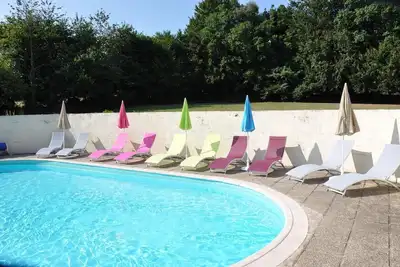 Image de Maison de vacances 'Les 3 Gîtes De Kerlividic' avec piscine partagée, jardin partagé et Wi-Fi