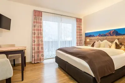 Image de Doppelzimmer mit Balkon - Appartments und Pension Mariandl