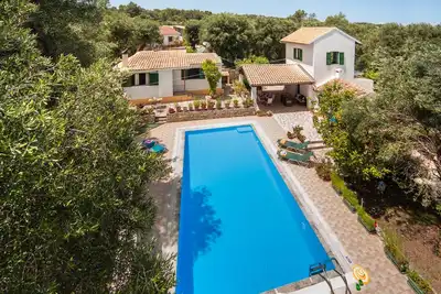 Image de Indulge in Peace: A Paxos Sanctuary by the Olive Groves.