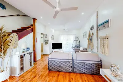 Renovated 3rd-floor condo near beach with pool, balconies, streaming, W/D, Ac