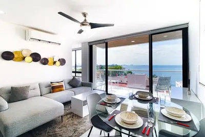 Image de Modern ocean view apartment with balcony, rooftop pool, & well-equipped kitchen