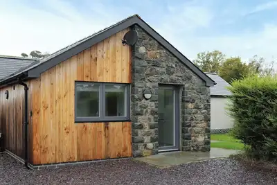 Image de This immaculate cottage with hot tub will not disappoint.