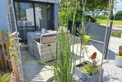 Image de Appartement cosy à la mer, accès direct à la plage!