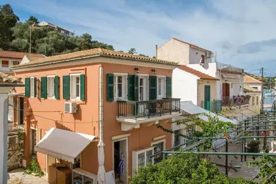 Charming Lakka Retreat: Angelina Apartment with A/C and Central Square Balcony