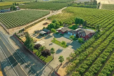 Image de Cherry-tree-lined country escape with a pool