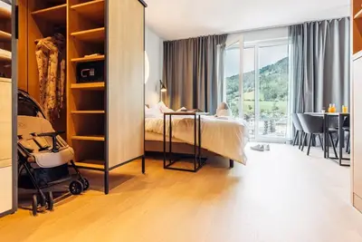 Image de Familienzimmer, Dusche, Wc, Balkon - Hotel Harrys Home Bischofshofen