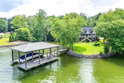 Lovely Home in a Quiet Cove w Kayaks, SUPs, Dock & Boat Opt - Near Charlotte