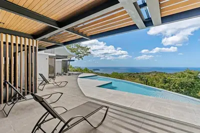 Luxurious Ultramodern Property with Private Suites, Infinity Pool, and Sweeping