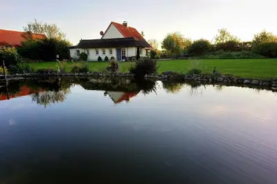Image de Maison de vacances \"Naturteich Haus\" avec étang de baignade privé, terrasses privées et Wi-Fi
