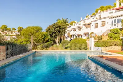 Image de Appartement 'Sillero Dos' avec piscine partagée, terrasse privée et climatisation