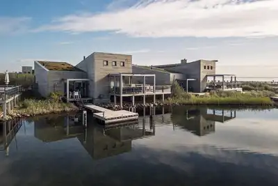 The terraces of a 4-person Villa Super Vip are located directly by the water, with access to a private swimming pier, jacuzzi and Infrared sauna.
