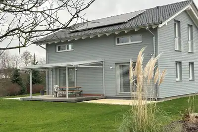 Image de Entire house next to black forest