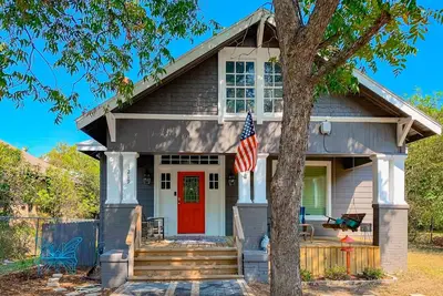 Whimsical home in a great location with front porch, full kitchen, W/D, and Ac