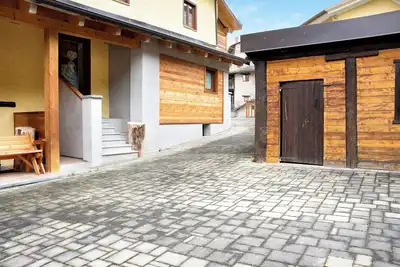 Image de Appartement 'Chalet Provenzale Trilocale' avec jardin partagé et Wi-Fi