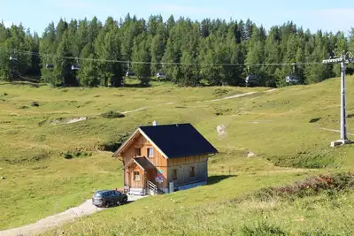 Image de Maison de vacances 'Kleine Winklerhütte' avec vue sur les montagnes et jardin privé