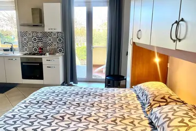 Image de Cozy studio flat with patio, 5 minutes to Fiumicino airport.
