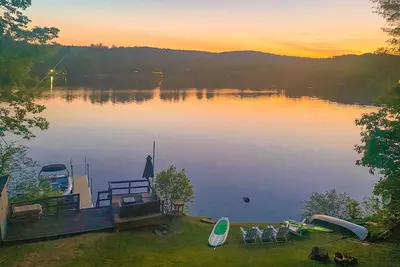 Image de Lakefront home near ski resorts with water view, dock, deck, fireplaces, & W/D