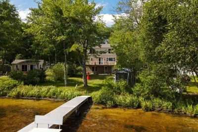 Image de Spacious 3 level home on Little Sebago Lake with sandy entry.