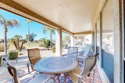 Image de Palm-lined home with pool access, grill, office & golf course views