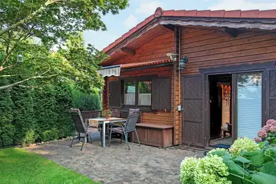 Image de Maison de vacances 'Haus Cürsgen - Blockhaus Jana' avec terrasse privée et Wi-Fi