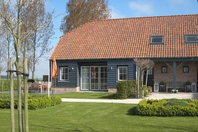 Image de Maison de vacances de style Ă Zuidzande avec sauna