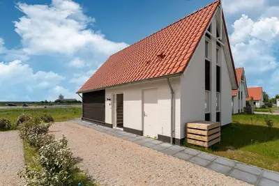 Image de Maison de vacances א Scherpenisse avec jardin