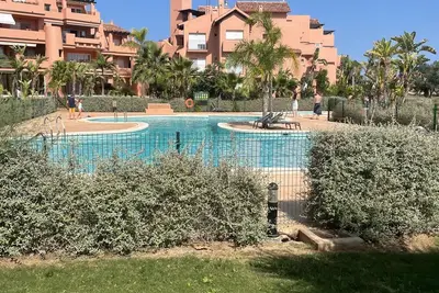 Image de Appartement dans un complexe de golf avec piscine
