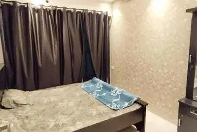 Image de 1bhk flat fully furnished bedroom, hallway with single bed balconies.