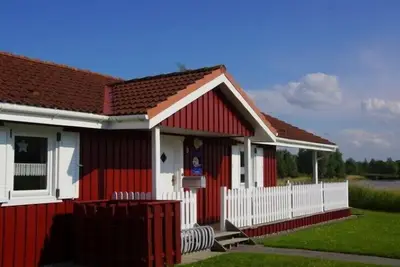 Image de 4 person vacation home with wood-burning stove, conservatory and canoe, with a wonderful view of the lake in Otterndorf