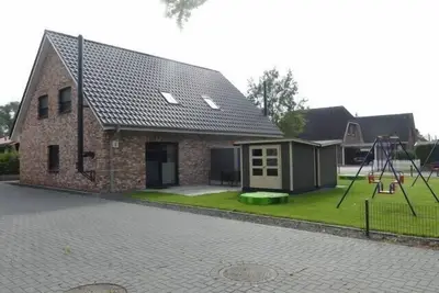 Image de 6-person vacation home with sauna, whirlpool, two showers and toilets and wood-burning stove in Otterndorf