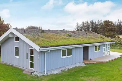 Image de Maison de vacances pour 8 a Blokhus-By Traum