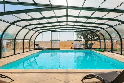 Image de Maison de vacances 'Gîte Le Petit Sableau' avec piscine et Spa, terrasse privée et Wi-Fi