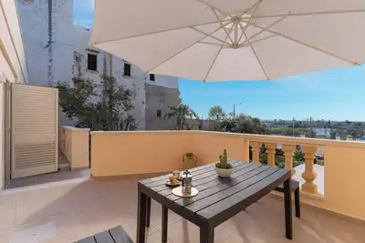 Image de Appartement 'Casa Vacanza Sotto La Lizza' avec terrasse privée et climatisation