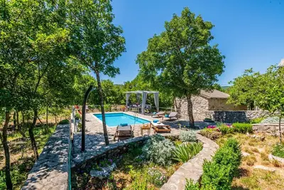 Image de Rustic three-room Villa Ognjistar with a beautiful garden and luxury  private pool surrounded by peace and nature near the Makarska Riviera