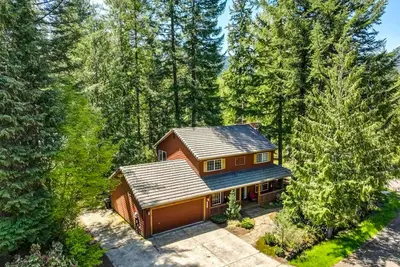 Dog-friendly home with hot tub, shared pool, firepit, fireplace, & river access