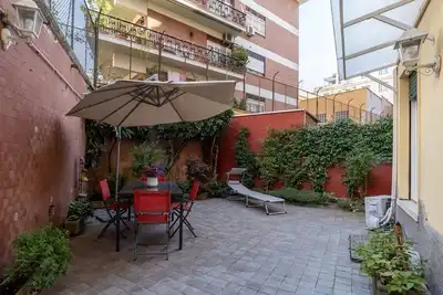 Image de Apartment located on the ground floor of a 5-storey building. There are steps at the entrance. In 60 m2 of space it accommodates 4 people. Private garden for the exclusive use of guests, table with chairs and ground umbrella. The property is an excellent