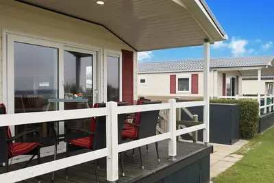 Image de Ostseechalet Strandmuschel - Direkter Meerblick, Überdachte Terrasse, Parkplatz