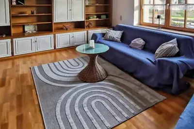 Image de The beautiful apartment with separate entrance is on the 1st floor and accessible via 7 steps. The apartment is quietly located and only a few minutes away from the town center. The living space of 62 sqm consists of one bedroom with a. . .