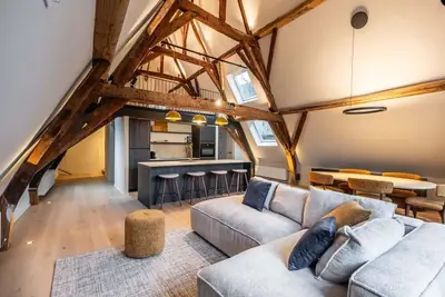 Image de Huswell - City-view loft with wooden beams and mezzanine