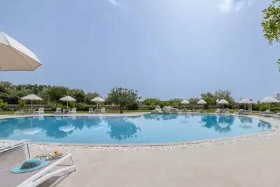 Image de Appartement 'Tenuta Vigna Corallo - Mimosa' avec piscine partagée, Wi-Fi et climatisation