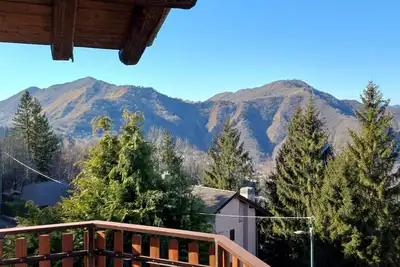 Image de Appartamento con Camino a Legna, Giardino Privato Recintato e Vista Spettacolare