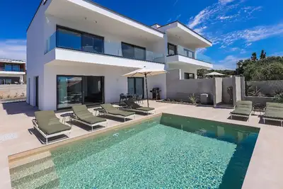 Image de Maison de vacances Novalja pour 1 - 8 personnes avec 3 chambres à coucher - Maison jumelée