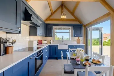 Image de Recently converted stables with lake view