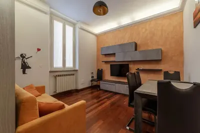 Image de GuestHost - Comfortable apartment located on the second floor, of four in total, of a building without lift. In 40 m2 of space it accommodates four people with a double bedroom on the mezzanine and a foldaway double bed in the living room. It is located