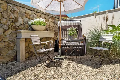 Image de Appartement 'Gästewohnung Am See - Suite Maritim' avec terrasse privée, jardin privé et Wi-Fi