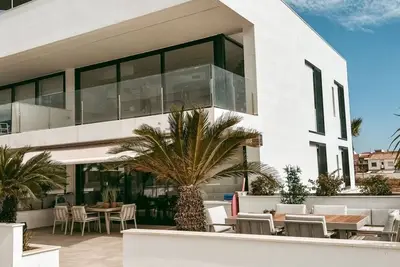 Image de Luxurious apartment with large sunny terrace within walking distance to the sea and stores.