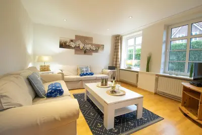 Image de Ferienhaus Seestern - Familienfreundliches Ferienhaus für 5 Personen mit Sauna und Garten. Hunde Willkommen!