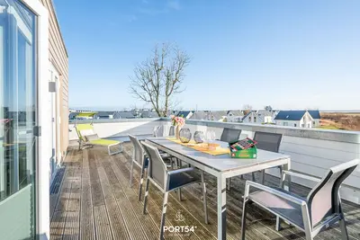 Image de Küstenliebe - Infrarotsauna, Kamin, Duschbad, Wannenbad, Dachterrasse, Meerblick